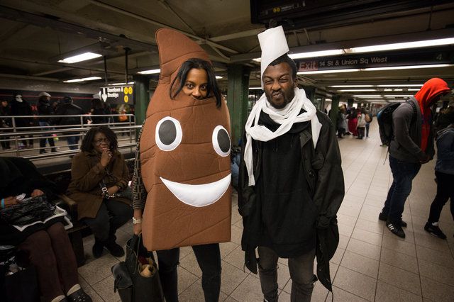 Ignore the poop emoji on the left. The brilliant costume here belongs to the guy on the right with toilet paper all over his head. It's both a practical costume AND a good setup for someone to find their own poop emoji soulmate.